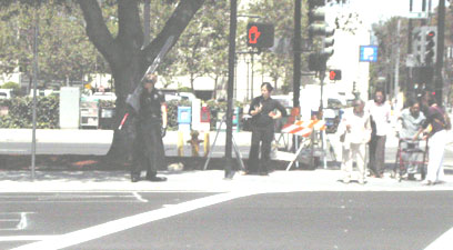Cloud Strife cosplayer waiting for the crosswalk at FanimeCon 2006
